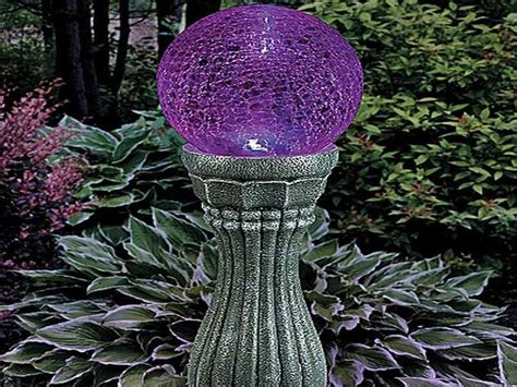 outdoor solar globe on pedestal.